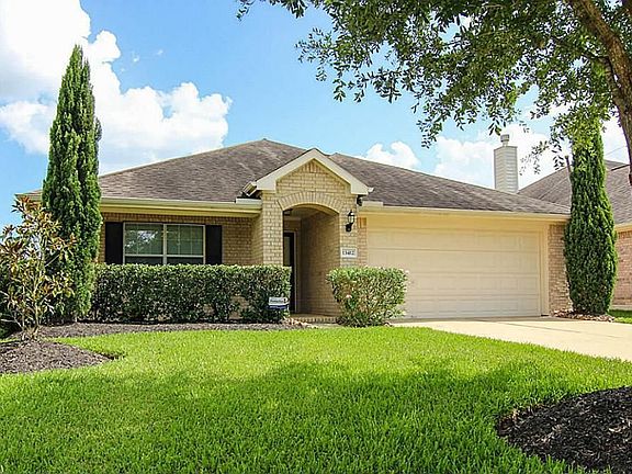 No more dragging hoses!  This beautifully landscaped yard has a sprinkler system!