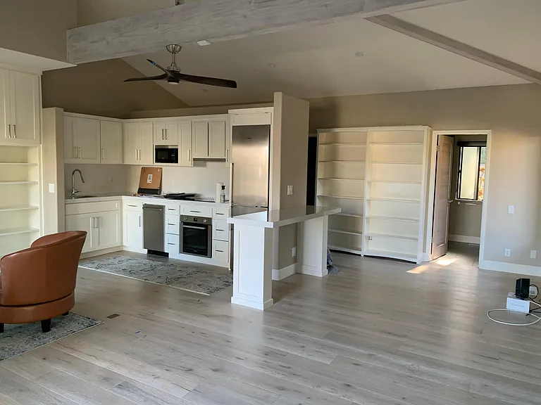 Extensive custom cabinets and bookshelves.