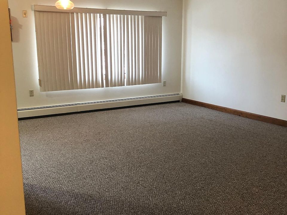 Open concept dining/living room with huge picture window.
