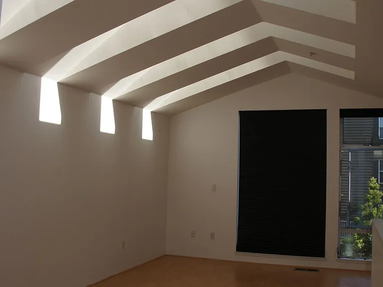 Bedroom Loft - skylights provide beautiful natural light. 
Shades on windows have two options. Shear for during the day, Black out shades keep it nice and dark while you sleep.