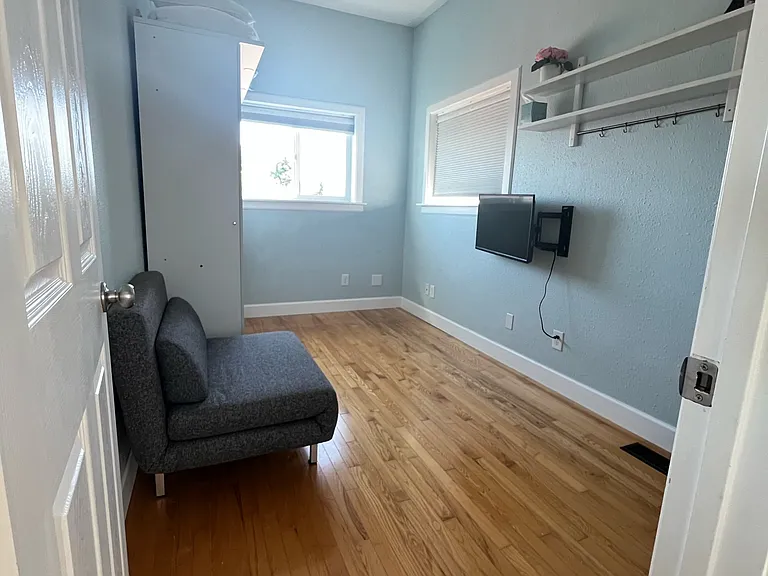 Smaller top floor bedroom with full size pull down bed. Along with a couch chair that folds out to a single bed.