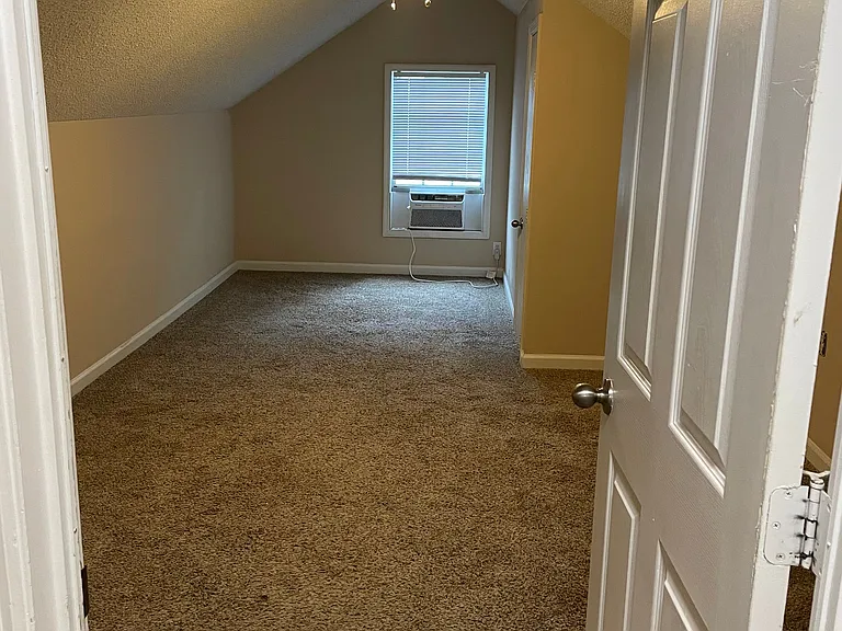 Take the stairs to the 2nd floor, immediately at the top of the stairway, on the left, is bonus bedroom above garage