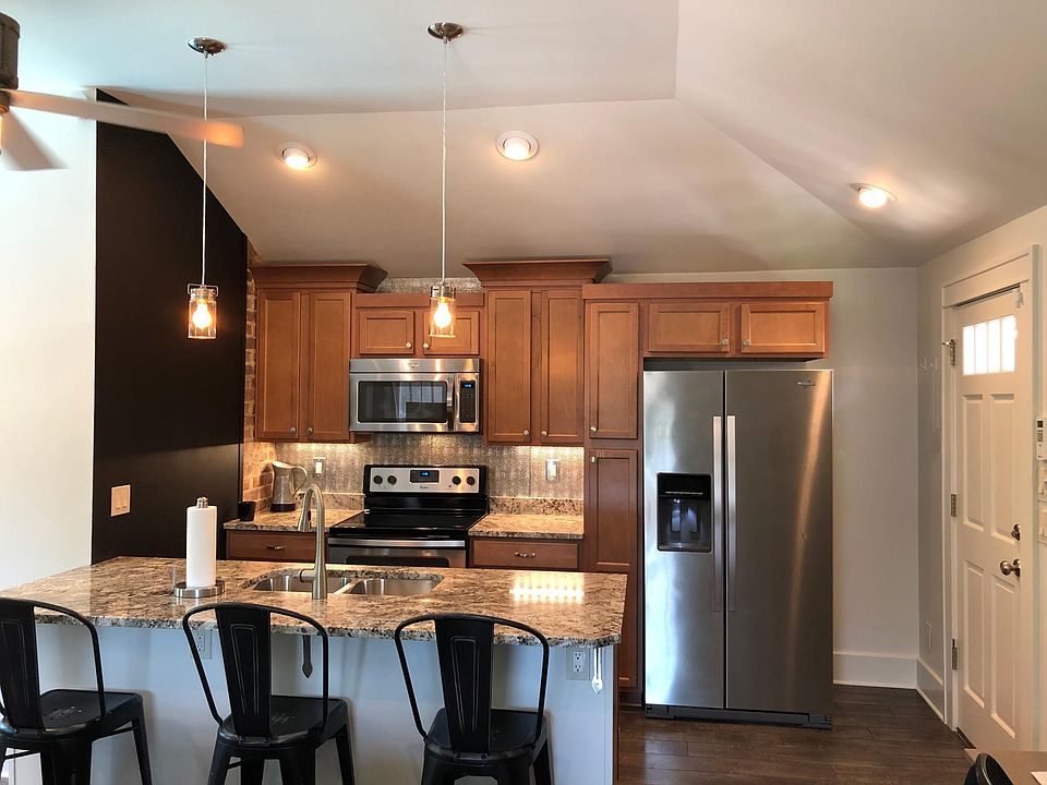 Full kitchen - electric stove and oven, microwave, dishwasher and fridge.