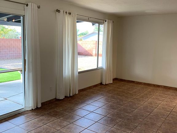 Fresh paint, great view of backyard and new drapes in family/living room