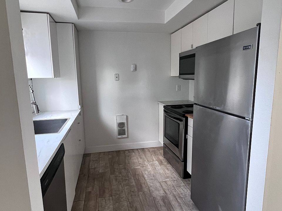 Galley kitchen, new Ikea kitchen, large sink with professional faucet, garbage disposal, dishwasher, stainless steel appliances, tile floor, large floor to celling panty, LED lighting.