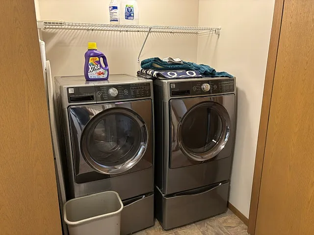 First-floor laundry closet outside of upstairs bedrooms and hall bath.