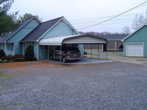 Side view of the house and carport.