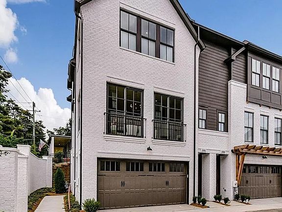 Bright and sunny end unit with 2 car garage and EV charging port