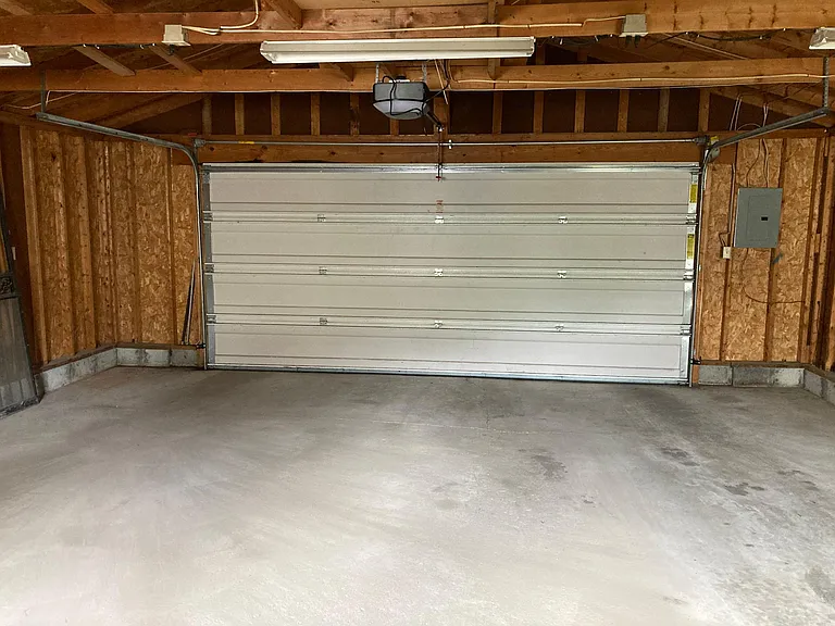 Power doors in 2 car plus modern detached garage