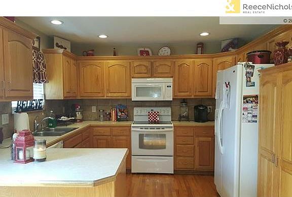 Loads of cabinets.  New tile backsplash.  Wood floors and pantry.