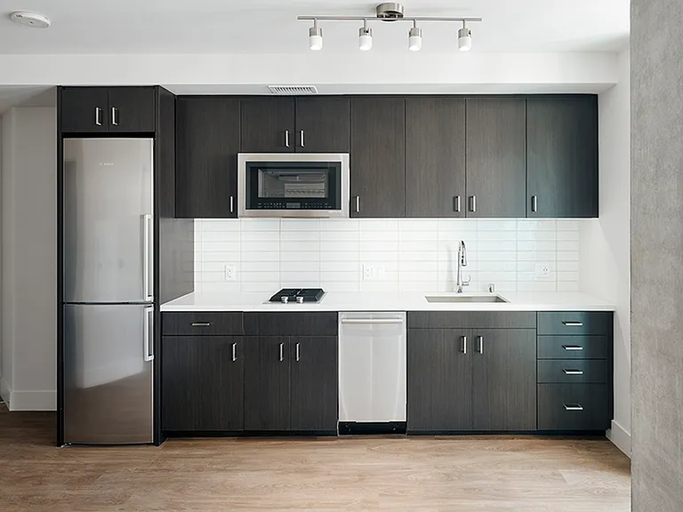 Beautiful kitchens with custom wood cabinetry, speed oven, and sleek stainless steel appliances