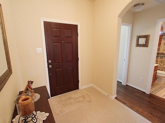 FOYER LOOKING TO THE HALLWAY WHERE THE SECONDARY BEDROOMS AND A SECOND BATH ARE LOCATED.