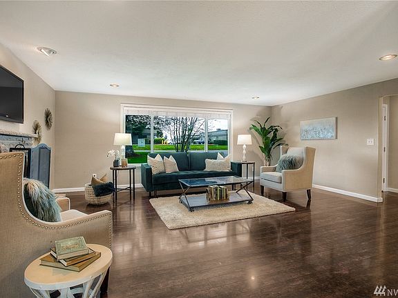 Beautiful floors and a large picture window are beautiful features in this well cared for home.