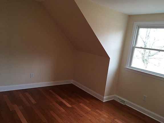 2nd bedroom with maple wood floors throughout apartment