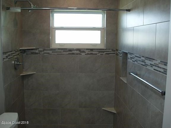 TILED SHOWER AND WINDOW