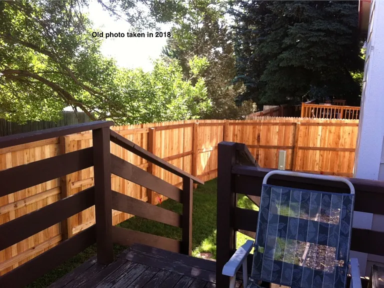deck view of fenced backyard