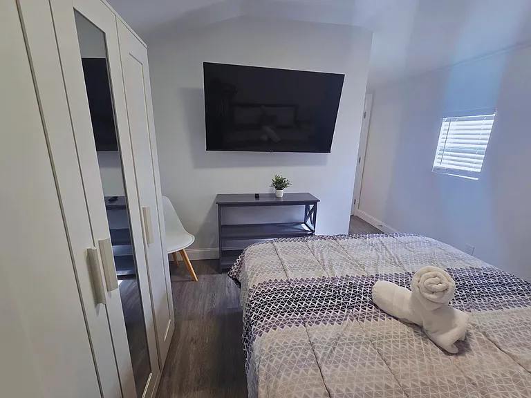 Well-lit bedroom with decor that creates a warm ambiance