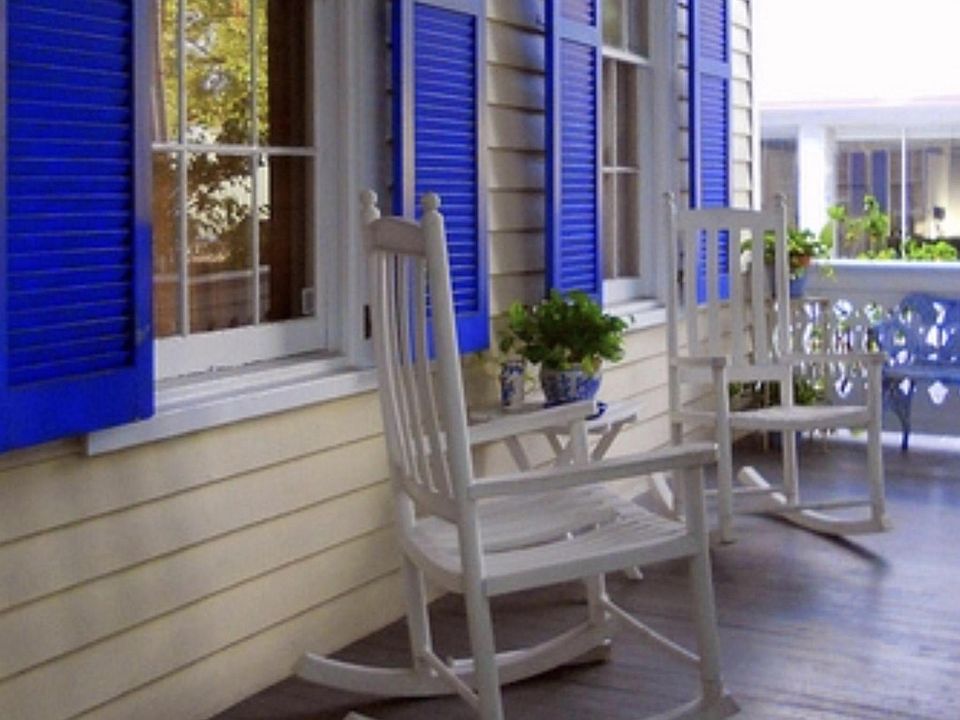 Rocking Chairs on First Floor of building.