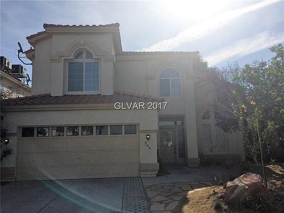 Large xeriscaped frontyard to keep water costs low