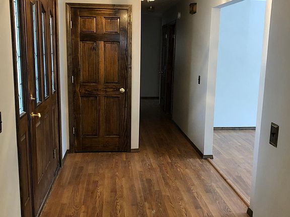 Well-lit entryway welcomes guests into the living room
