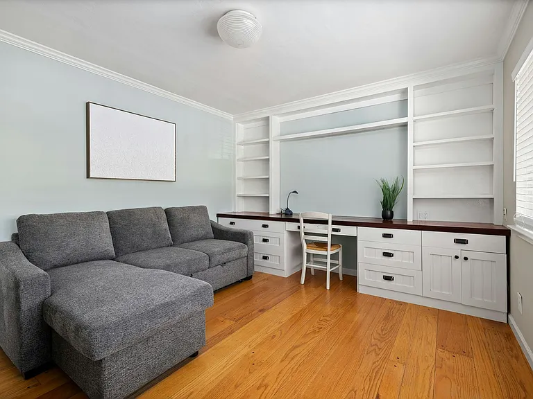 Work-from-home ready this built-in office features tons of storage, natural light, and a comfy pull-out for guests or midday breaks. Ideal as a study, guest room, or creative space.