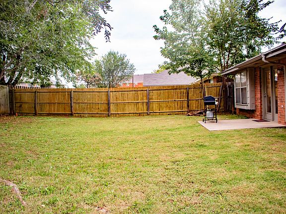 Portion of back yard, completely fenced