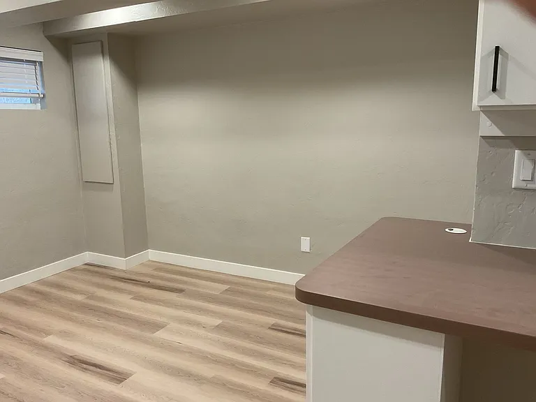 Basement view of area for couch and furniture.