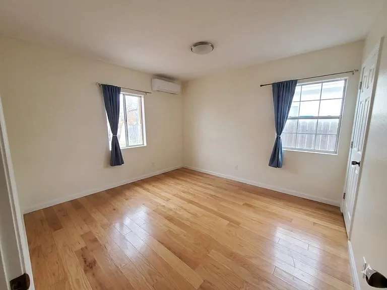 Bedroom #2: double windows with plenty of sunlight and facing the backyard.