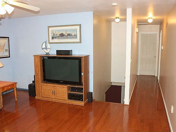 Hallway leads to three upstairs bedrooms.