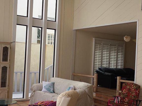 View from living rom into Den and second bedroom upstairs