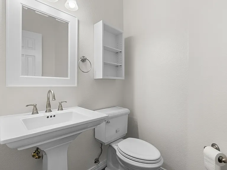 Conveniently located on the main floor, the downstairs half bath is ideal for guests and everyday use.