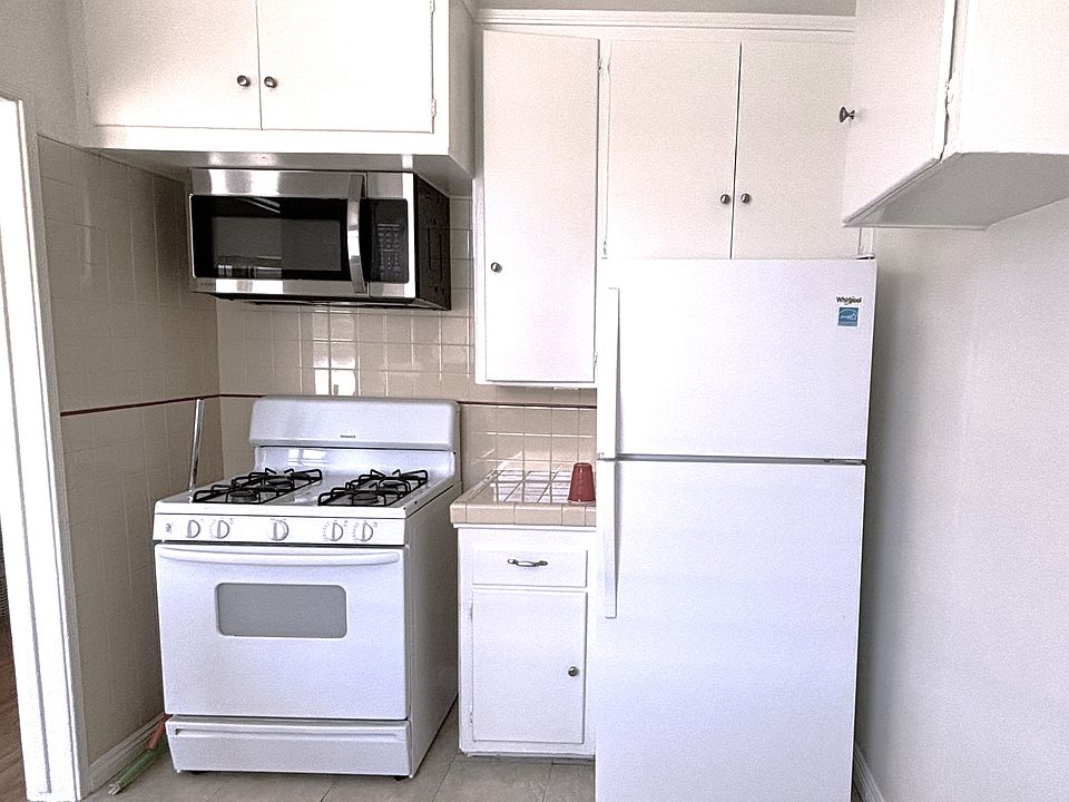 Kitchen includes: gas stove & oven, microwave, fridge