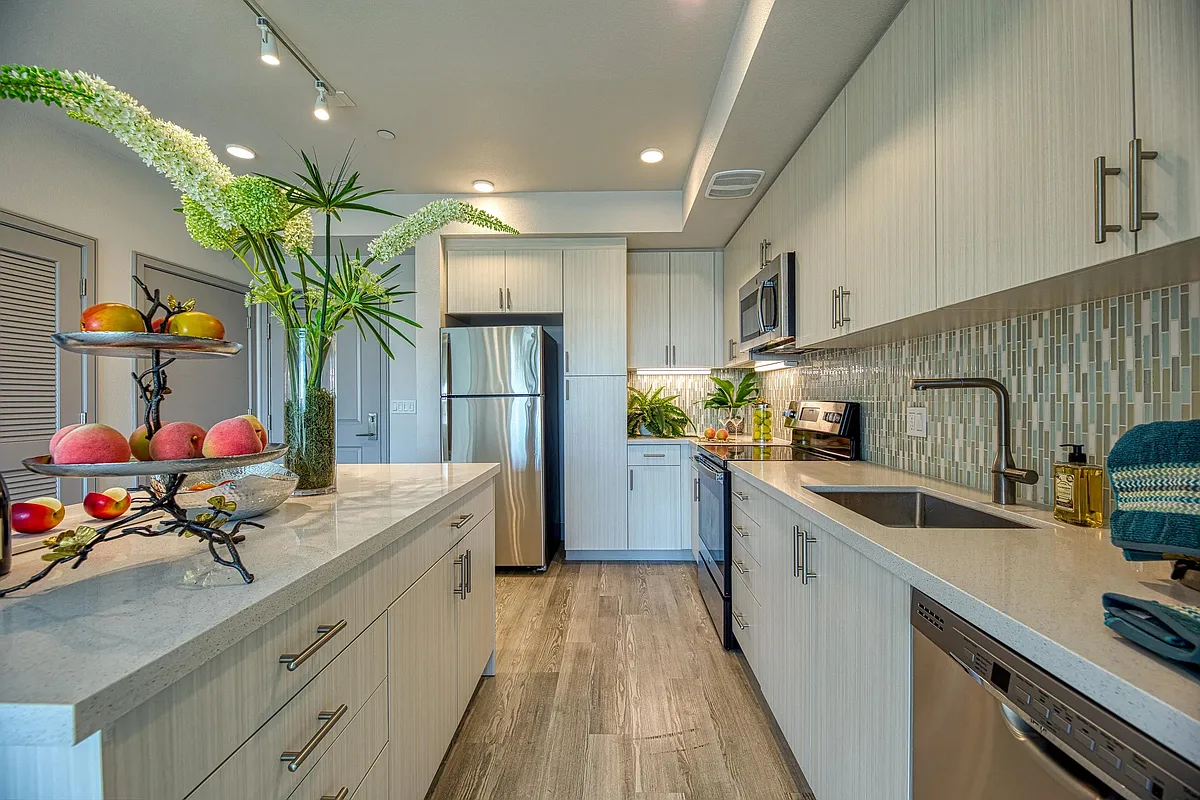 Light_filled kitchen with granite counters, energy_efficient appliances, and a clean, streamlined design. - Vespaio