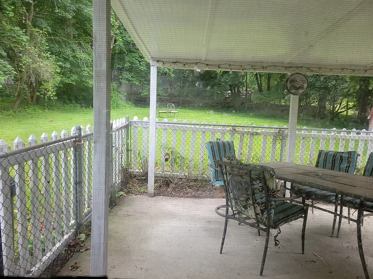Private covered patio off kitchen.