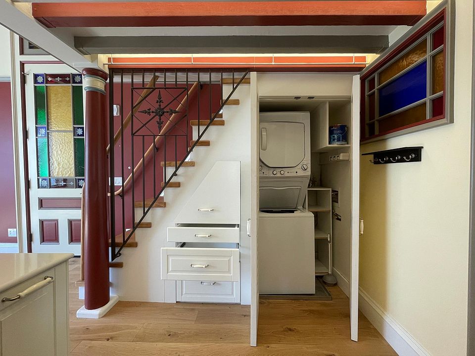 W/D and generous storage space under stairs.