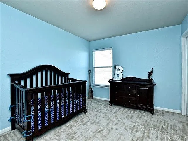 Second bedroom. Remote-controlled ceiling fan added in 2022.