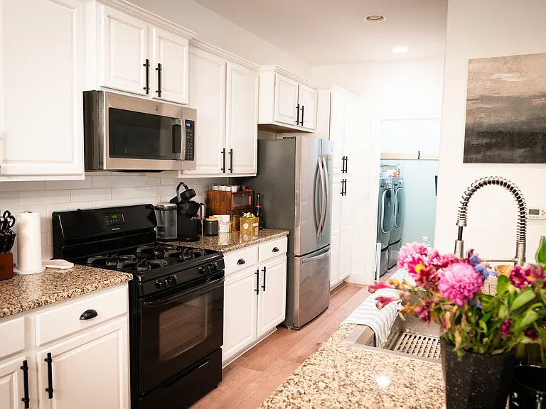 Another view of the remodeled kitchen with the brand new stainless steel french doors refrigerator!