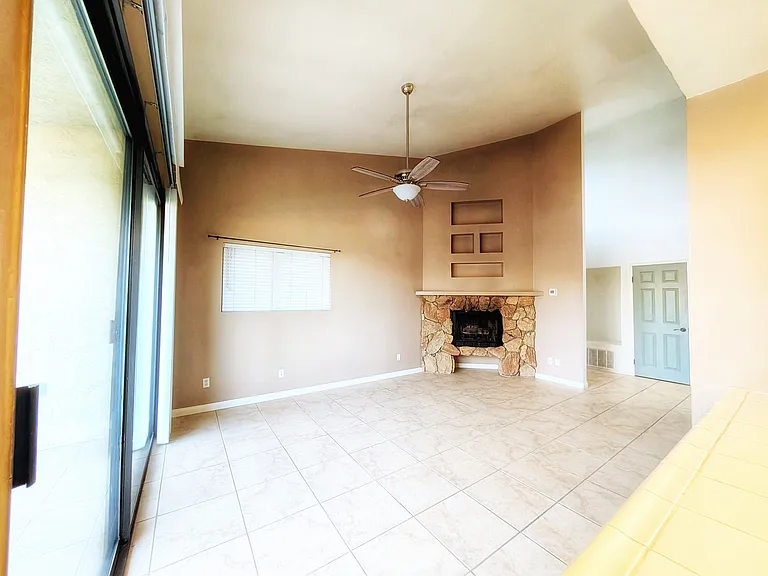 Spacious living room with fireplace.