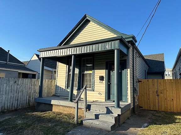 Covered Porch and Fenced Back Yard