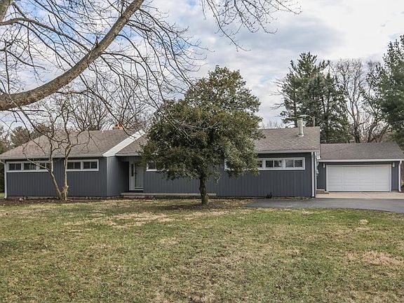 Sweeping driveway leading to beautifully updated home.