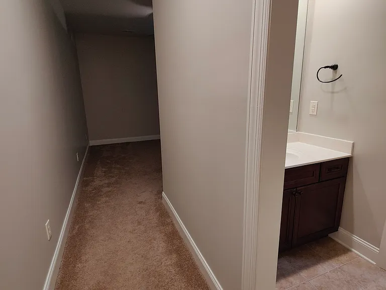 Walk way to the front side bedroom.