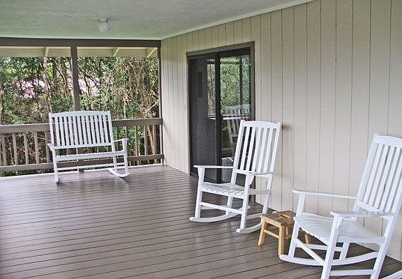 Open airy 336 sqaure foot lanai with distant peekaboo ocean view.