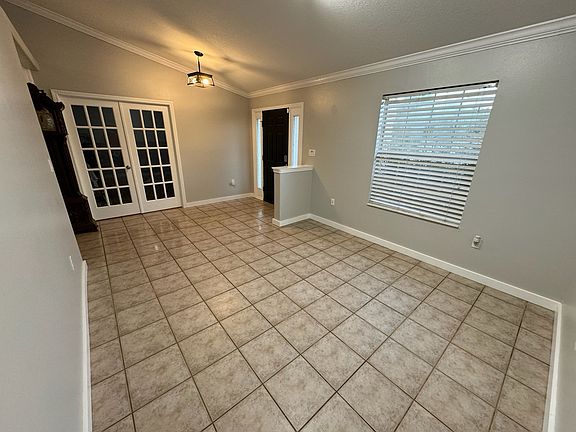 Front entry way is spacious and bright. Can be used as a formal living or dining area.