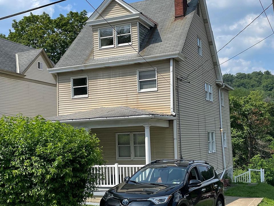 Front with driveway/parking pad