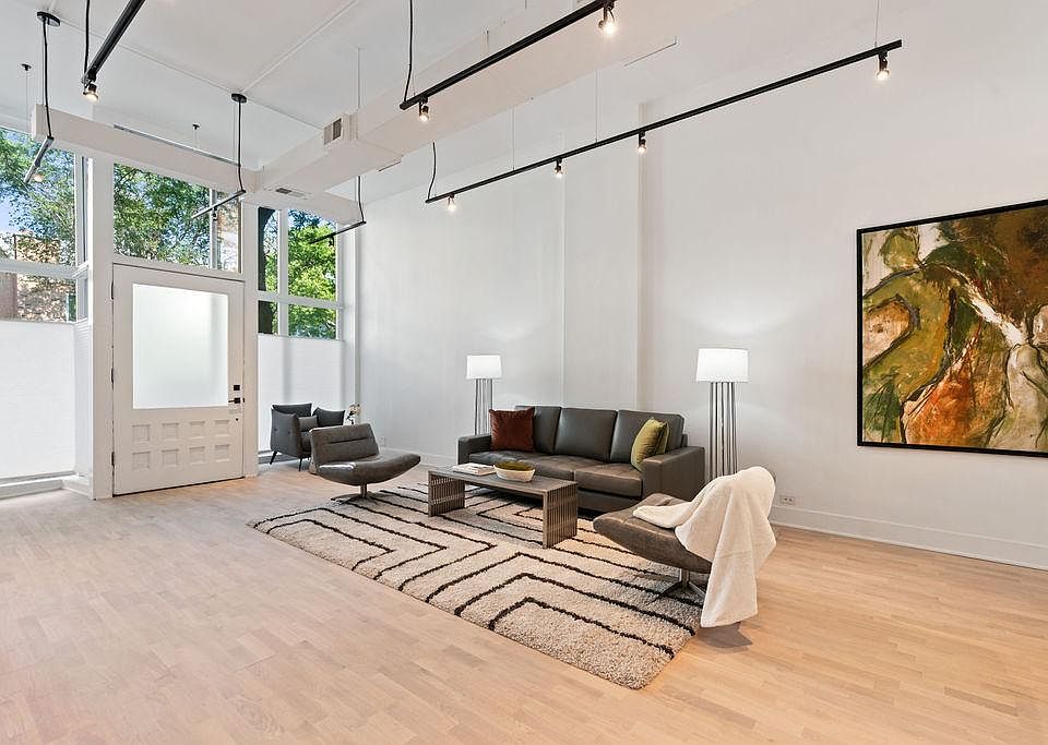 High Ceilings, Track lighting, Oak floors and white walls open this space. Lots of Natural light