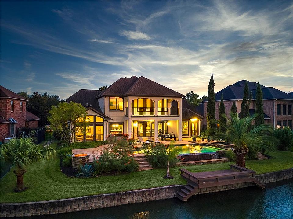 Welcome Home to 8018 Salta Verde where luxury lakefront living is at the forefront!