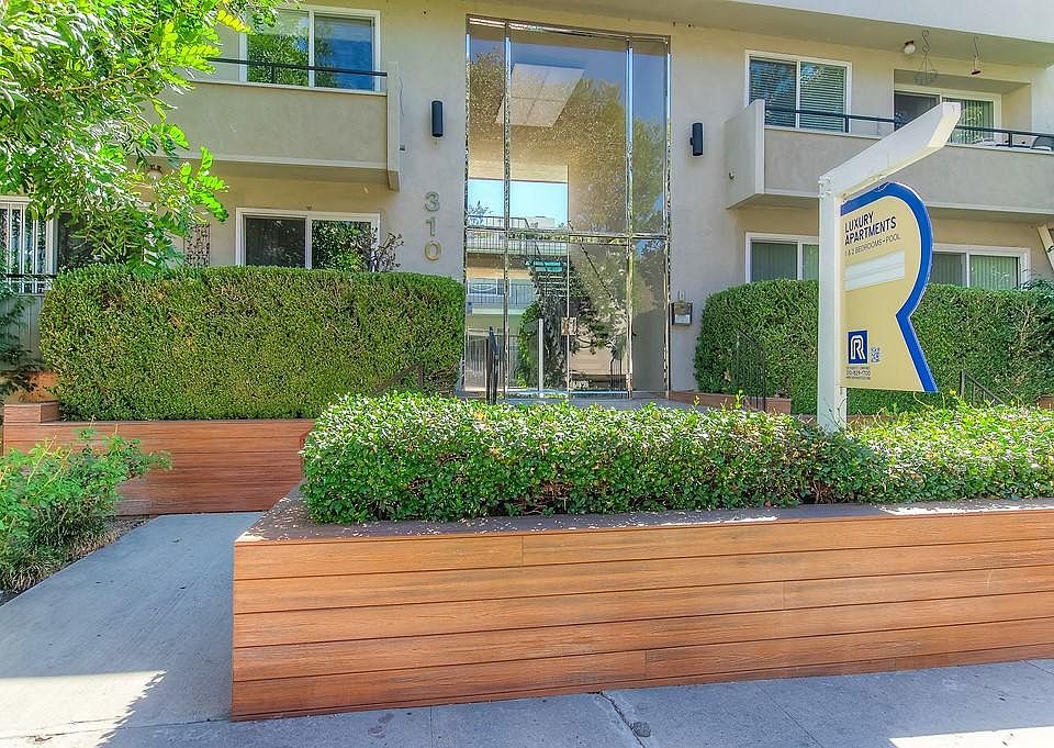 Secure entryway with beautiful landscaping.