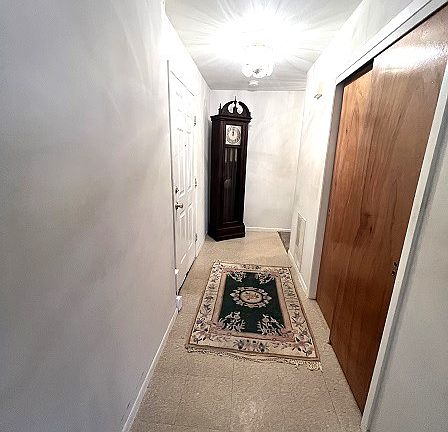 foyer into condo with half of coat closet for tenant use
