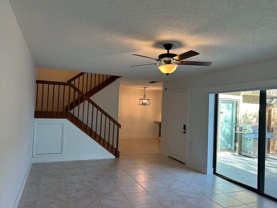 living room with dining room and private patio
