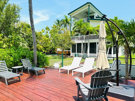 Deck view of house and hot tub